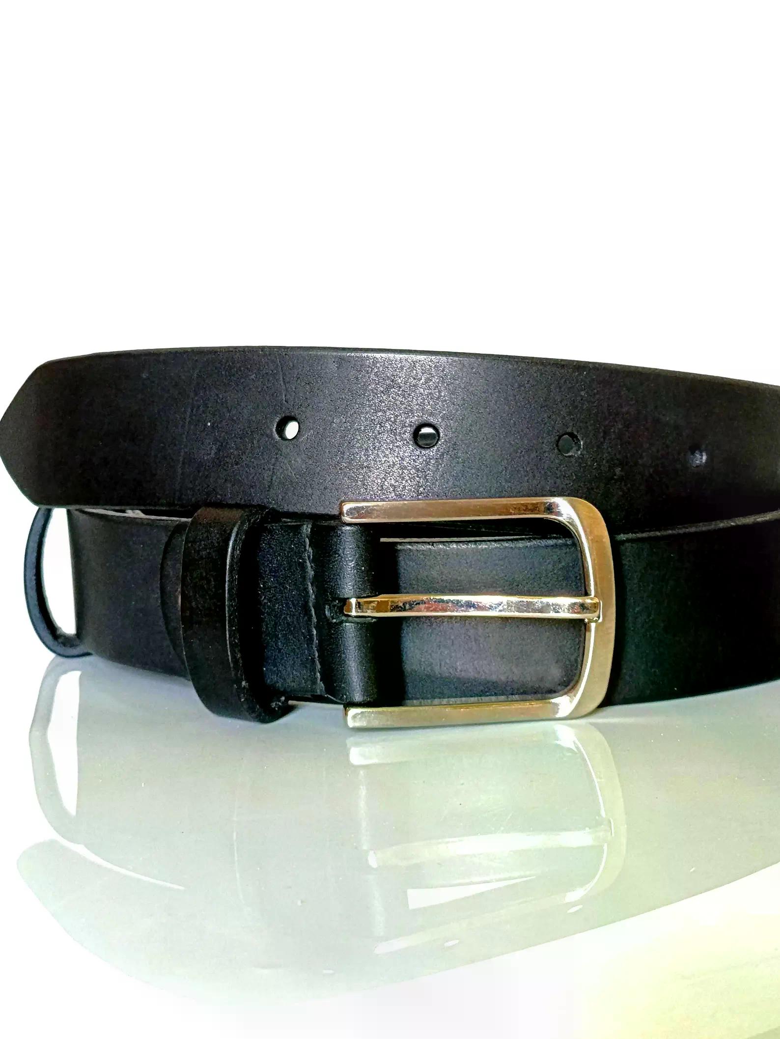 Handmade black leather belt with a silver rectangular buckle displayed on a light background