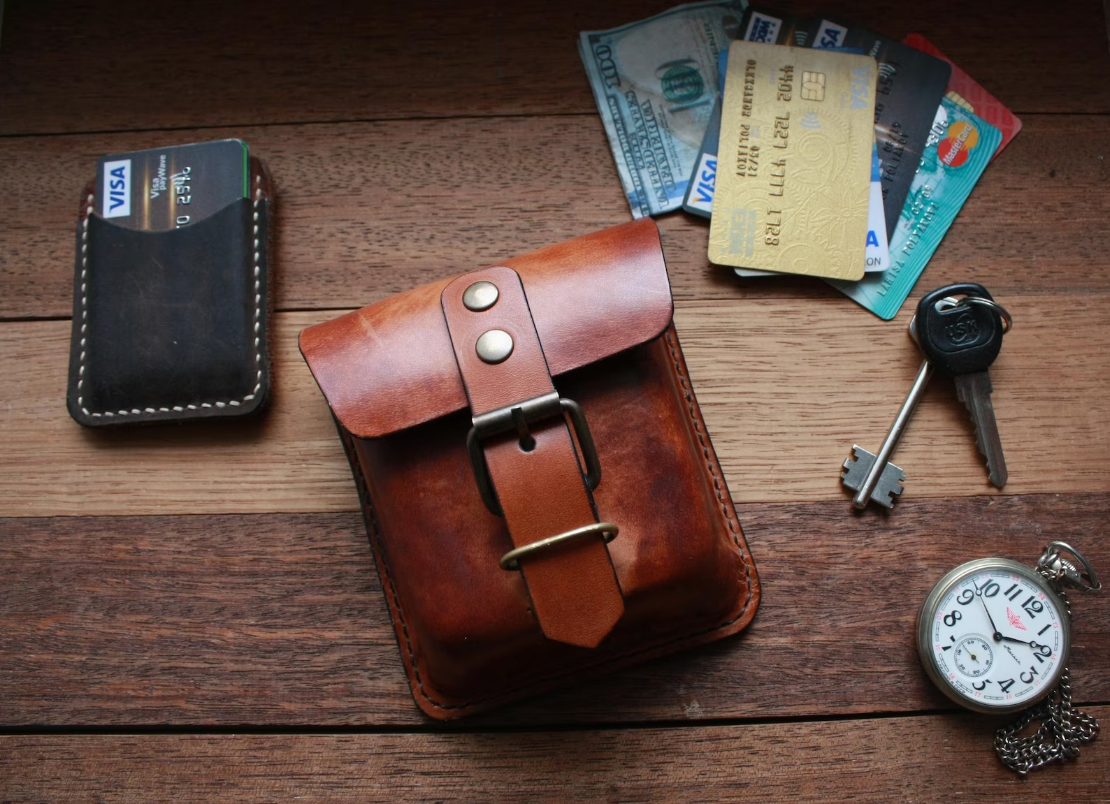Handmade  leather EDC pouch displayed with keys, cards and everyday carry accessories