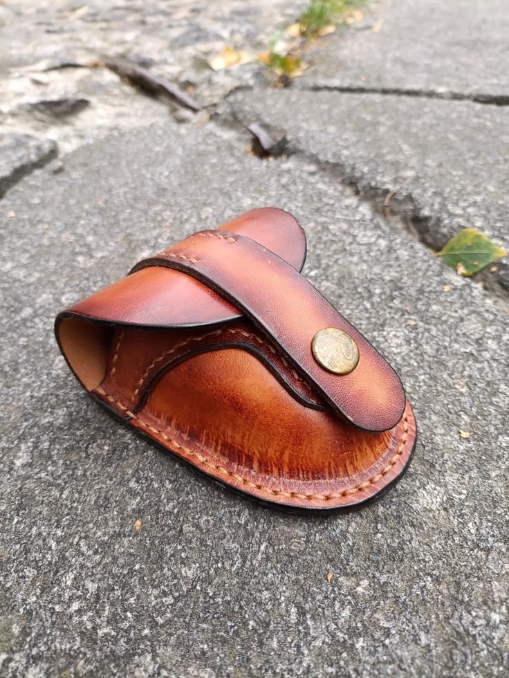 Handmade brown leather EDC pouch displayed with keys, cards and everyday carry accessories