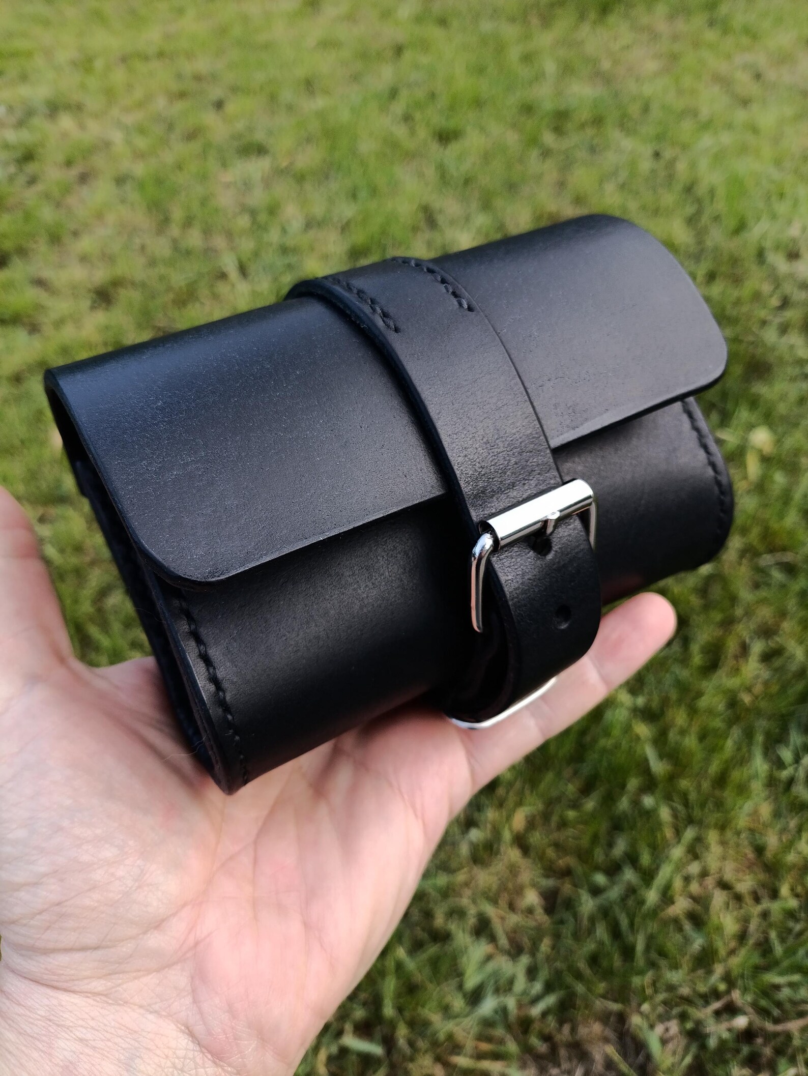 Handmade black leather EDC pouch displayed with keys, cards and everyday carry accessories