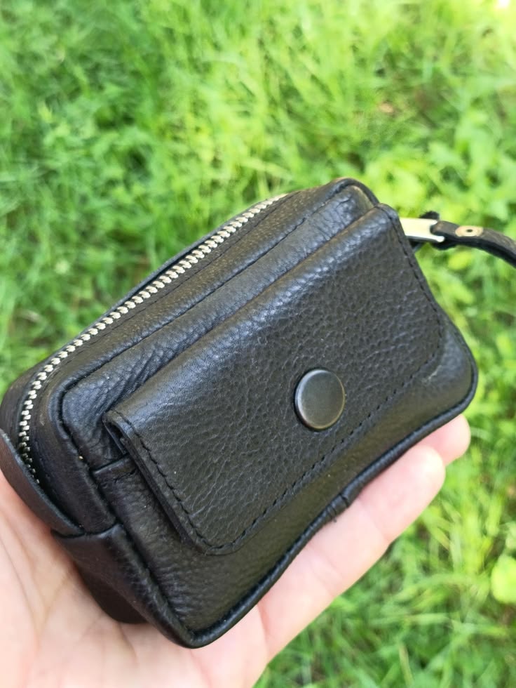 Handmade black leather EDC pouch displayed with keys, cards and everyday carry accessories