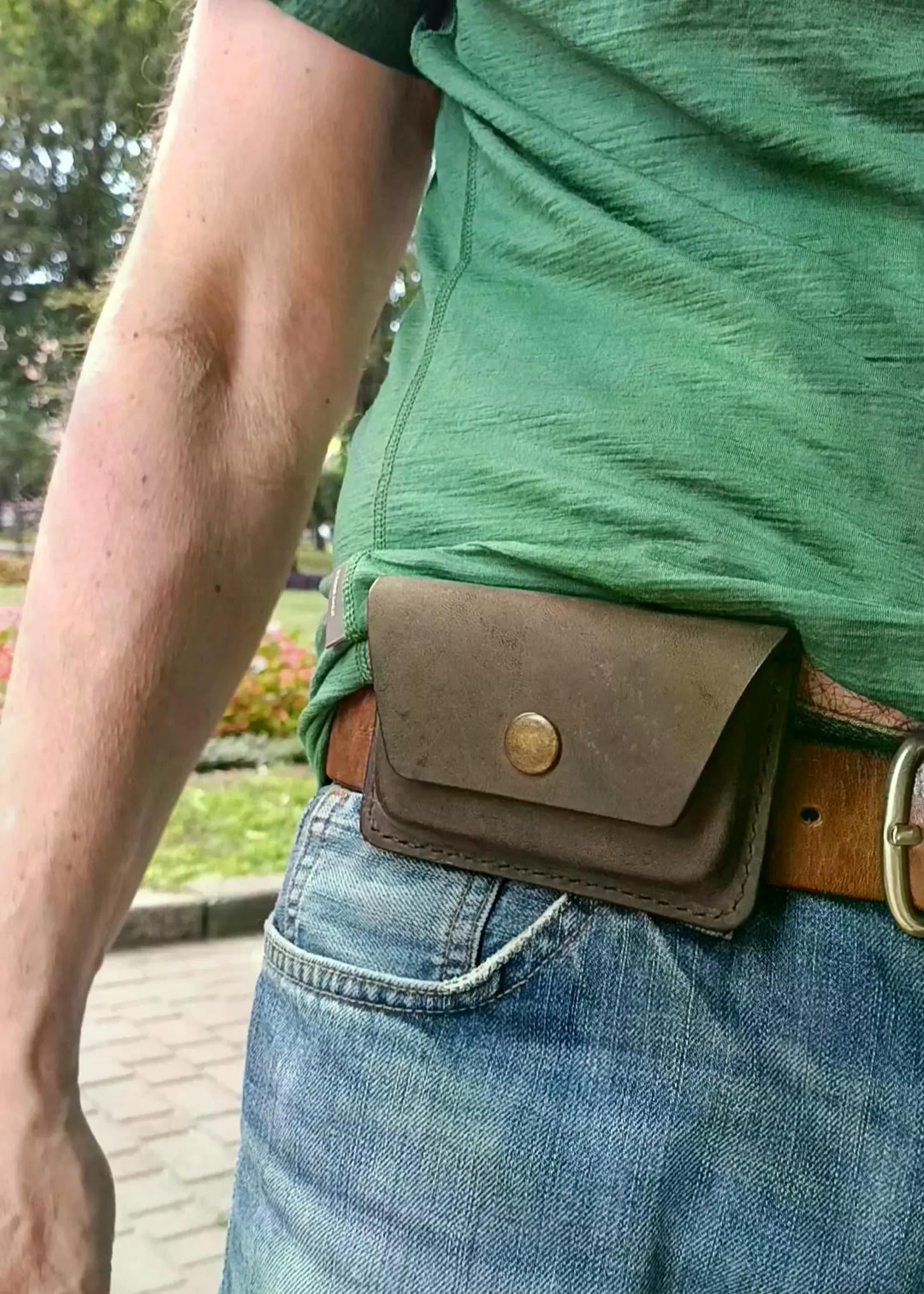 Handmade brown leather belt card holder worn at the waist