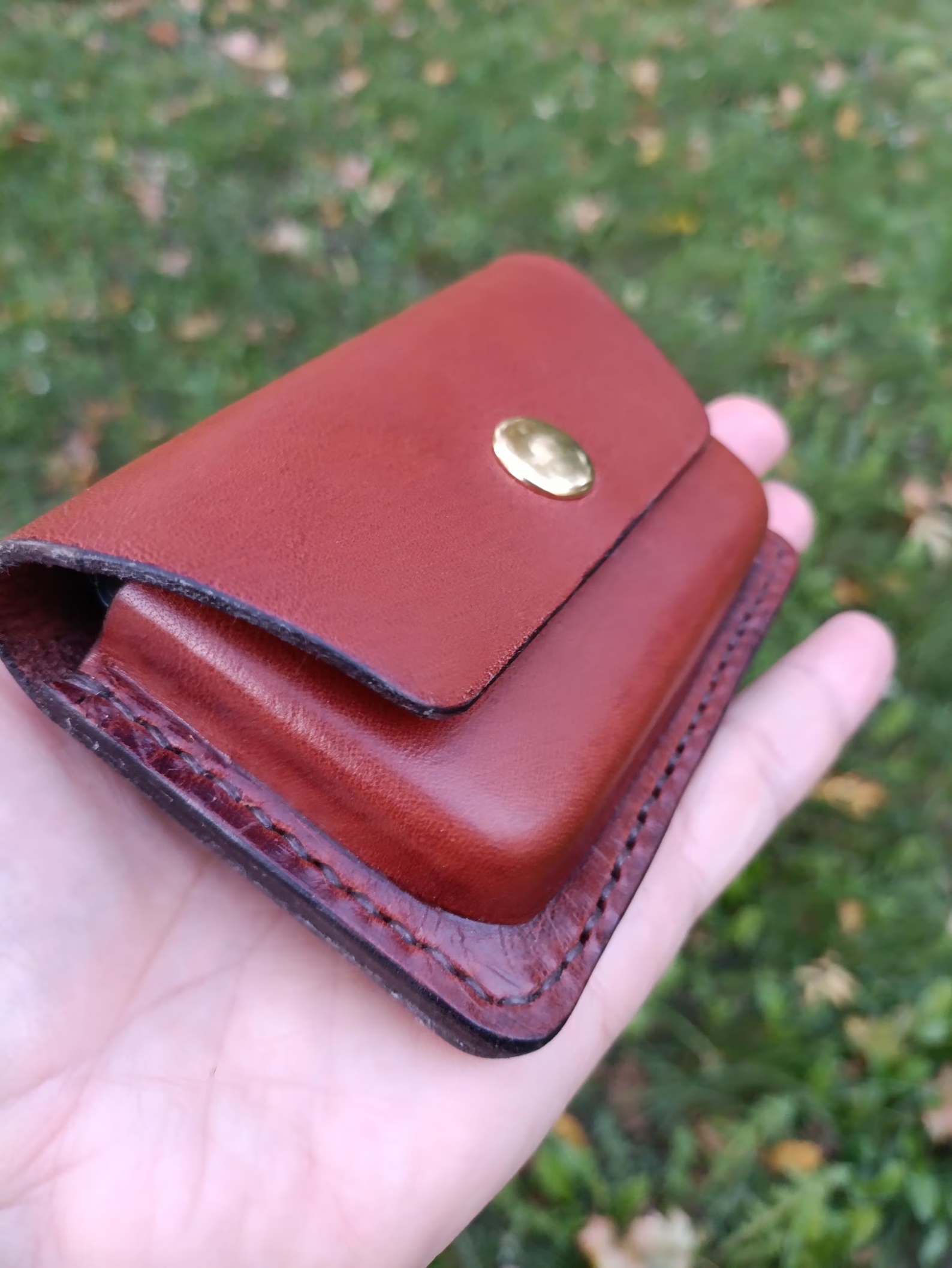 Handmade  leather EDC pouch displayed with keys, cards and everyday carry accessories